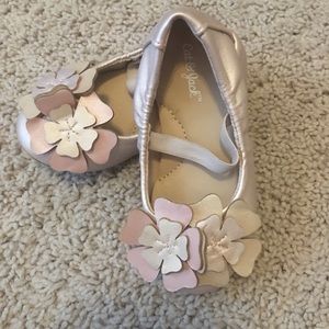 Worn once!  Gold ballet flats with flower detail
